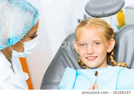 Dentist inspecting patient Dentist inspecting patient 36268187