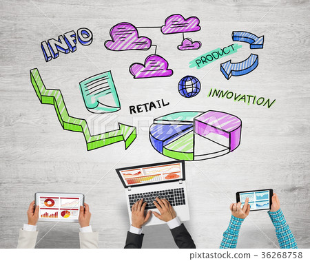 Top view of businesspeople sitting at table and using gadgets Top view of businesspeople sitting at table and using gadgets 36268758