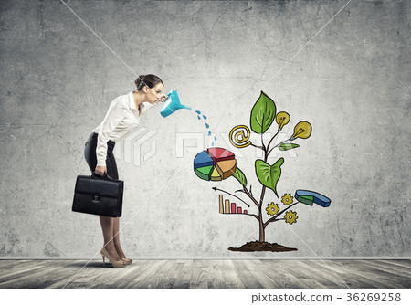 Young businesswoman in empty room watering drawn growth concept with can Young businesswoman in empty room watering drawn growth concept with can 36269258