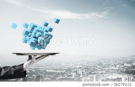 Hand of waiter presenting cubes on tray. 36270222