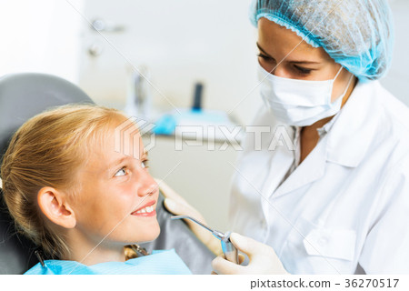 Dentist inspecting patient Dentist inspecting patient 36270517