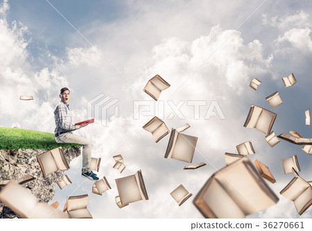 Man reading book and many of them flying in air Man reading book and many of them flying in air 36270661