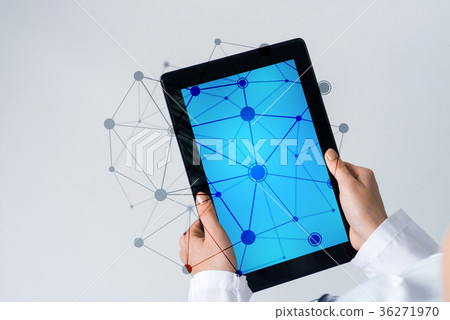 Close of female doctor hands working with tablet pc computer Close of female doctor hands working with tablet pc computer 36271970