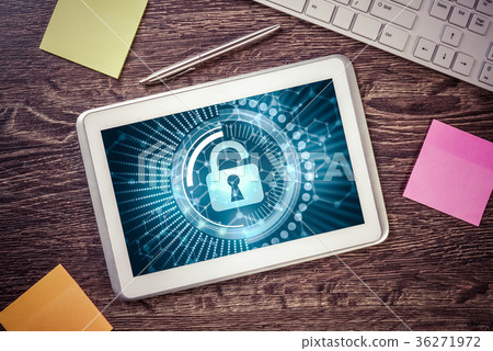 Business workplace with tablet pc and security concept on screen Business workplace with tablet pc and security concept on screen 36271972