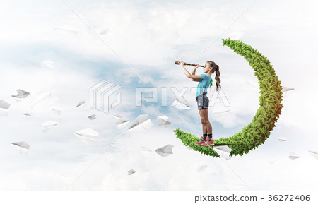 Concept of careless happy childhood with girl on green moon Concept of careless happy childhood with girl on green moon 36272406