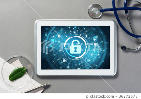 Web security and technology concept with tablet pc on table Web security and technology concept with tablet pc on table 36272575
