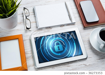 Web security and technology concept with tablet pc on wooden table Web security and technology concept with tablet pc on wooden table 36273353
