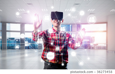 Guy wearing checked shirt and virtual mask reaching hand to touch screen 36273458