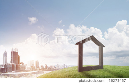 Conceptual image of concrete home sign on hill and natural landscape at background Conceptual image of concrete home sign on hill and natural landscape at background 36273467
