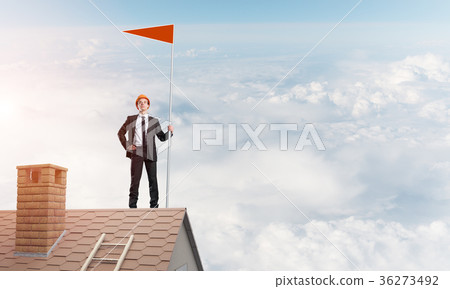 Young businessman with flag presenting concept of leadership. Mixed media 36273492