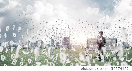 Young businessman or student studying the science and symbols fl Young businessman or student studying the science and symbols fl 36274122