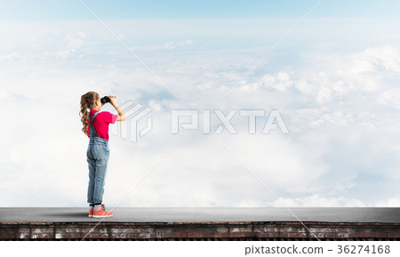 Concept of careless happy childhood with girl of school age looking in future 36274168