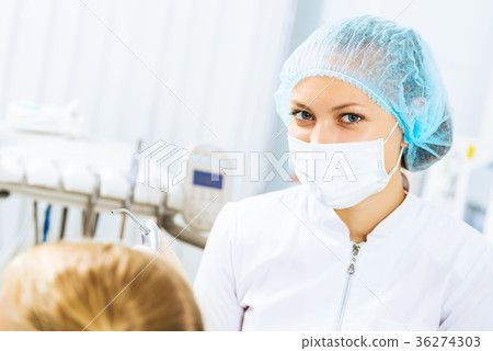 Dentist inspecting patient Dentist inspecting patient 36274303