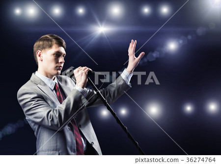 Businessman with microphone Businessman with microphone 36274764