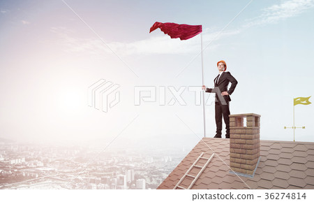 Young businessman with flag presenting concept of leadership. Mixed media 36274814
