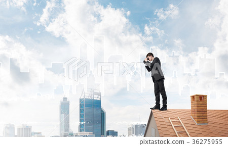Businessman standing on roof and looking in binoculars. Mixed media Businessman standing on roof and looking in binoculars. Mixed media 36275955