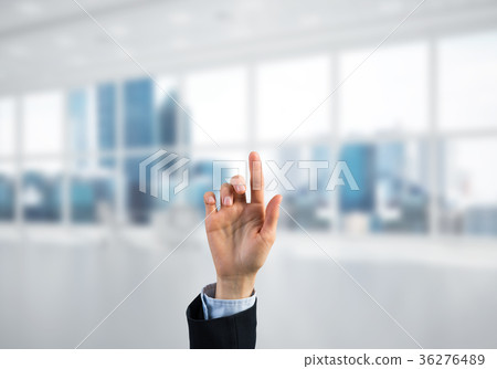 Choosing gesture of businessperson in elegant modern interior in sunshine light Choosing gesture of businessperson in elegant modern interior in sunshine light 36276489