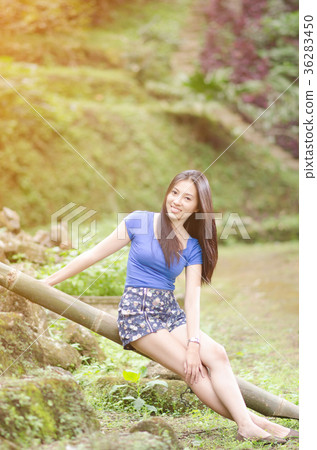 Asian girl sit down path in Bamboo forest 36283450