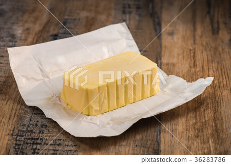 Plate of butter wrapping ready to eat 36283786
