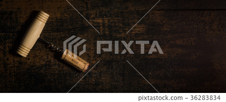 Vintage corkscrew with cork isolated 36283834