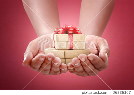 Human hands holding gift for boxing day 36286367