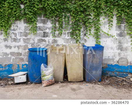 Garbage bags with food waste at dumpsters Garbage bags with food waste at dumpsters 36286470
