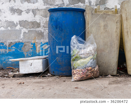 Garbage bags with food waste at dumpsters Garbage bags with food waste at dumpsters 36286472