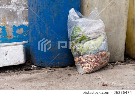 Garbage bags with food waste at dumpsters Garbage bags with food waste at dumpsters 36286474