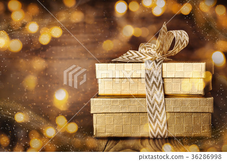 Shining giftboxes in golden glitters 36286998