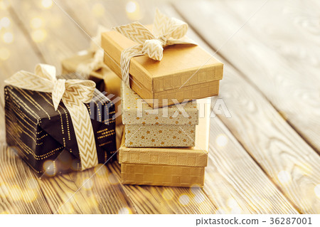 Wrapped presents in shining sparkles Wrapped presents in shining sparkles 36287001