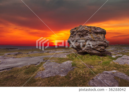 Huge limestone glacial erratic boulder at dusk Huge limestone glacial erratic boulder at dusk 36288042