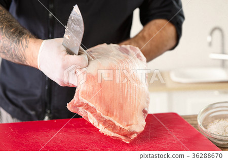 Man cooking meat steak on kitchen Man cooking meat steak on kitchen 36288670