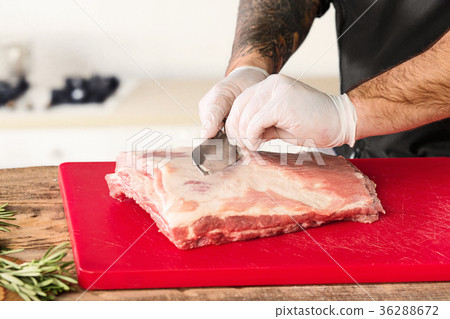 Man cooking meat steak on kitchen Man cooking meat steak on kitchen 36288672
