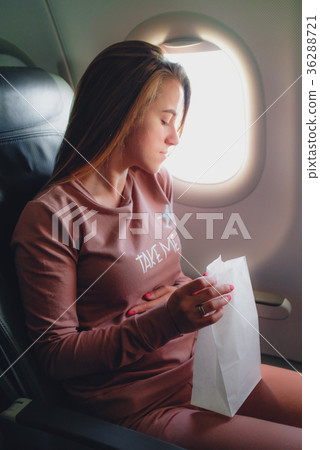 Girl is sick in the airplane 36288721
