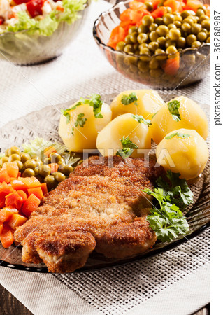 Breaded chop and potatoes Breaded chop and potatoes 36288987