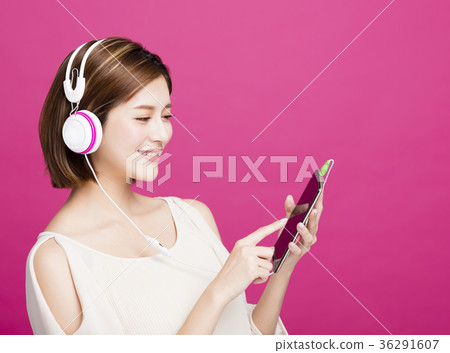 woman listening music with headphones  36291607