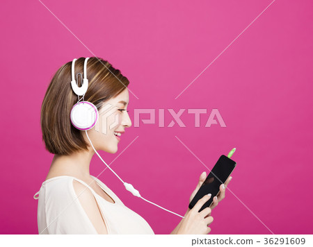 woman listening music with headphones  36291609