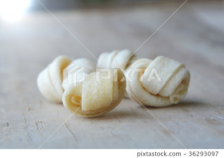 dog bone made from dried cow leather for pet 36293097