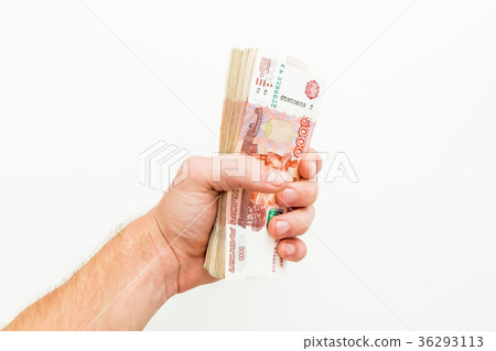 Russian banknotes 5000 rubles in men hand on white Russian banknotes 5000 rubles in men hand on white 36293113