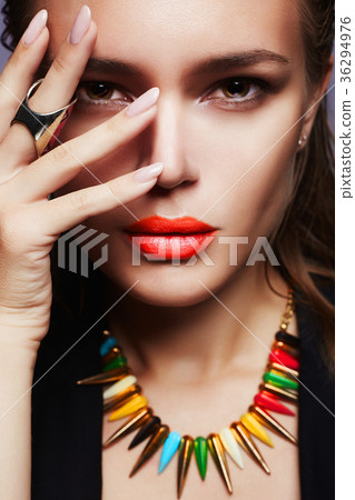 Beautiful woman in necklace and red lips 36294976