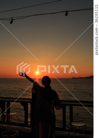 woman stretch her hand to the sky woman stretch her hand to the sky 36295115