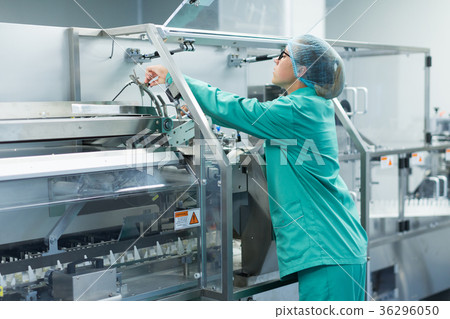 the operator controls the machine in the factory 36296050