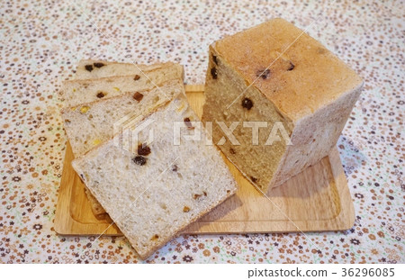 Bread with dry raisins, dried mango and pistachios Bread with dry raisins, dried mango and pistachios 36296085