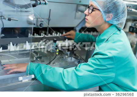 worker operates the machine at the enterprise 36296568