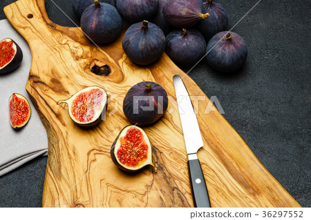 Fig isolated on dark concrete background Fig isolated on dark concrete background 36297552
