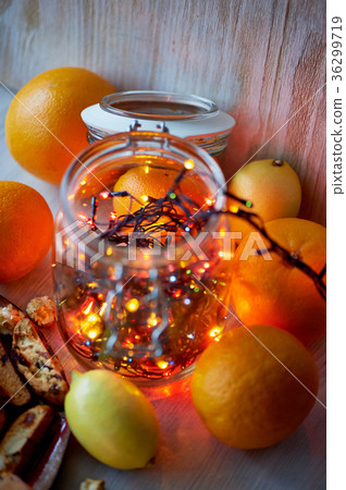 New year's table.Garland, glowing in a glass jar 36299719