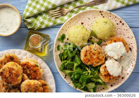 Chicken cutlets served with mashed potatoes. Chicken cutlets served with mashed potatoes. 36300026