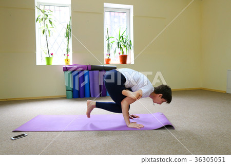 Young beautiful woman sitting on floor on mat for 36305051