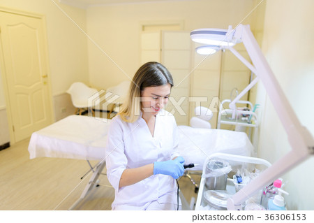 Professional female microblading master prepares 36306153