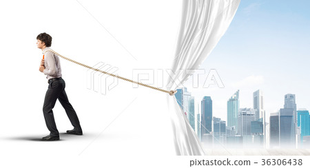 Young man opening white curtain and presenting modern city landscape Young man opening white curtain and presenting modern city landscape 36306438